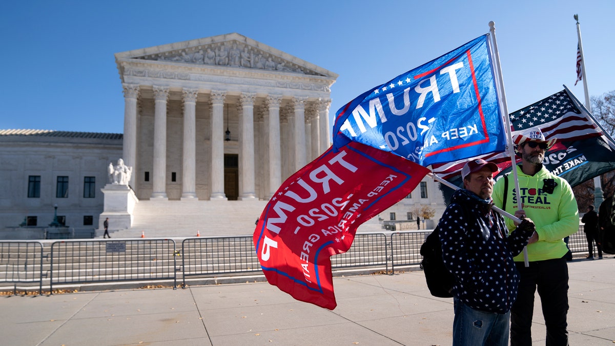 Supporters of U.S. President Donald Trump gather outside of the U.S. Supreme Court on December 11, 2020 in Washington, DC. The justices on Friday swatted away a lawsuit by Texas that aimed to nullify the presidential elections in four states that President-elect Biden won. (Photo by Stefani Reynolds/Getty Images)