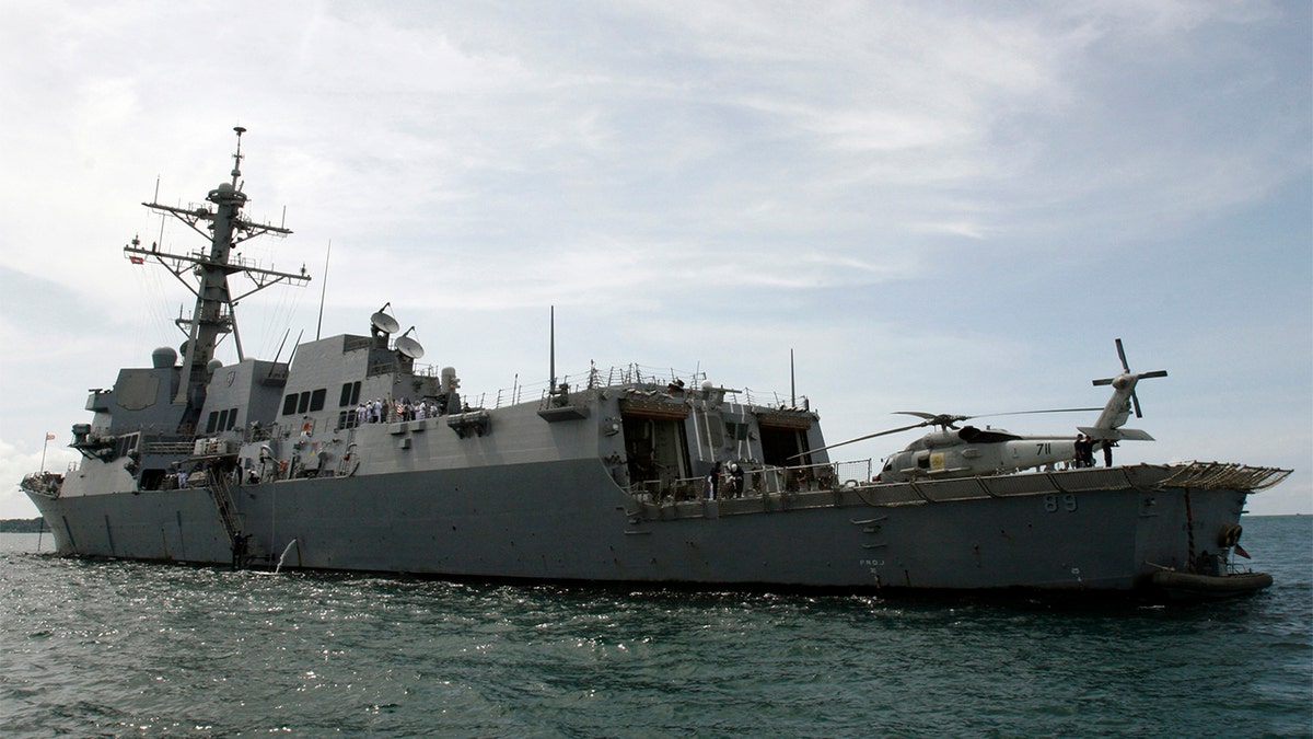  The warship USS Mustin sails near the port in Sihanoukville,  139 miles west of Phnom Penh, Oct. 11, 2008. The USS Mustin is in Cambodia to strengthen bilateral ties between the U.S. and Cambodia, and to carry out humanitarian and medical missions for locals, a U.S. embassy spokesman said. REUTERS/Stringer  