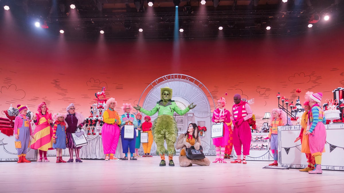 The cast of NBC's 'Dr. Seuss' The Grinch Musical!' donning colorful outfits as the whimsical residents of Whoville.