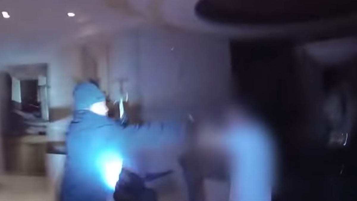 Screengrab from bodycam footage showing burglary suspect moments before he is shot by two Las Vegas police officers.
