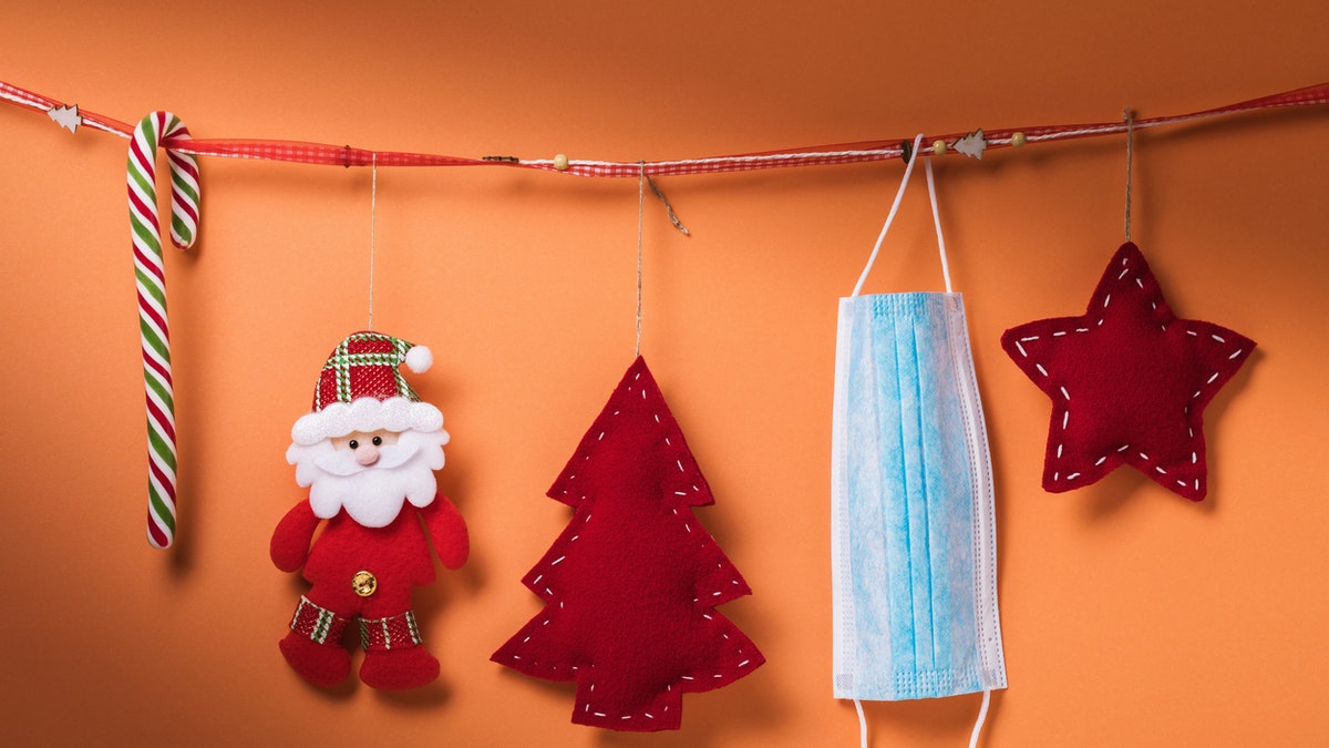 Healthcare workers are using PPE to help them decorate for the holidays this year. (iStock)