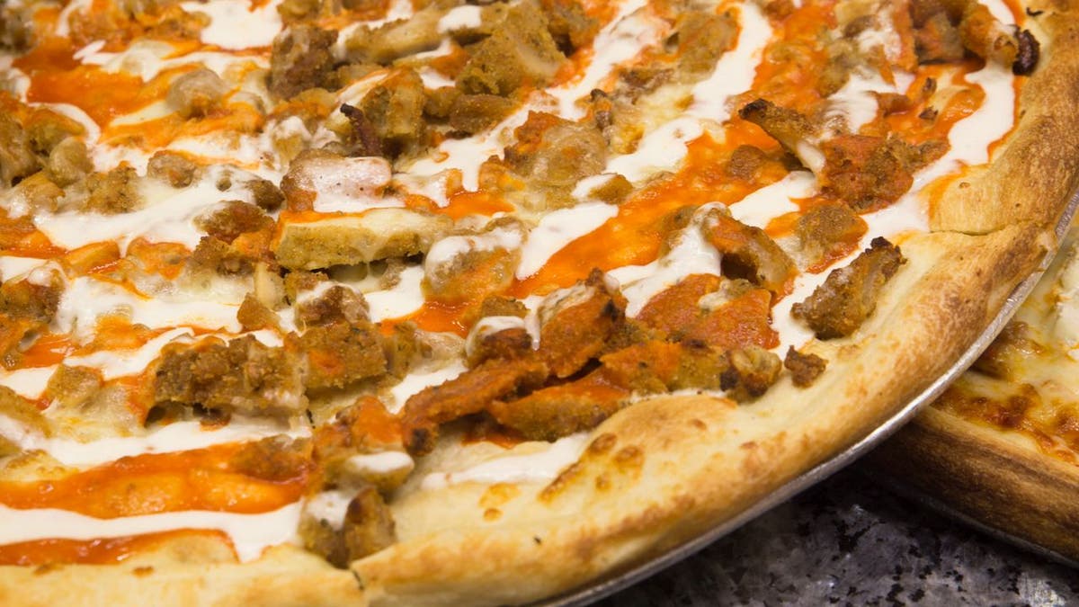 Buffalo chicken pizza offers a protein-based topping with a touch of tangy sauce. (iStock)
