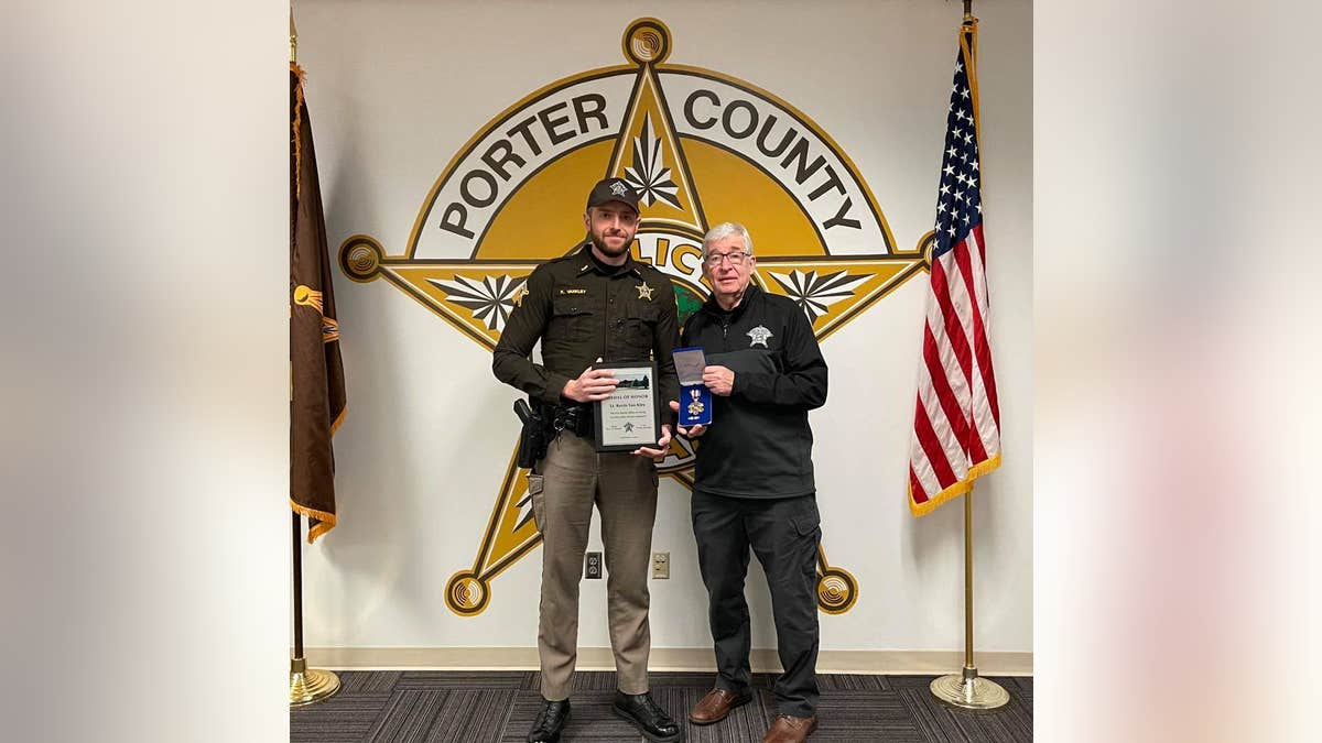 Porter County Sheriff David Reynolds honors Lt. Kevin Van Kley with the department's Medal of Honor. (Porter County Sheriff's Office)