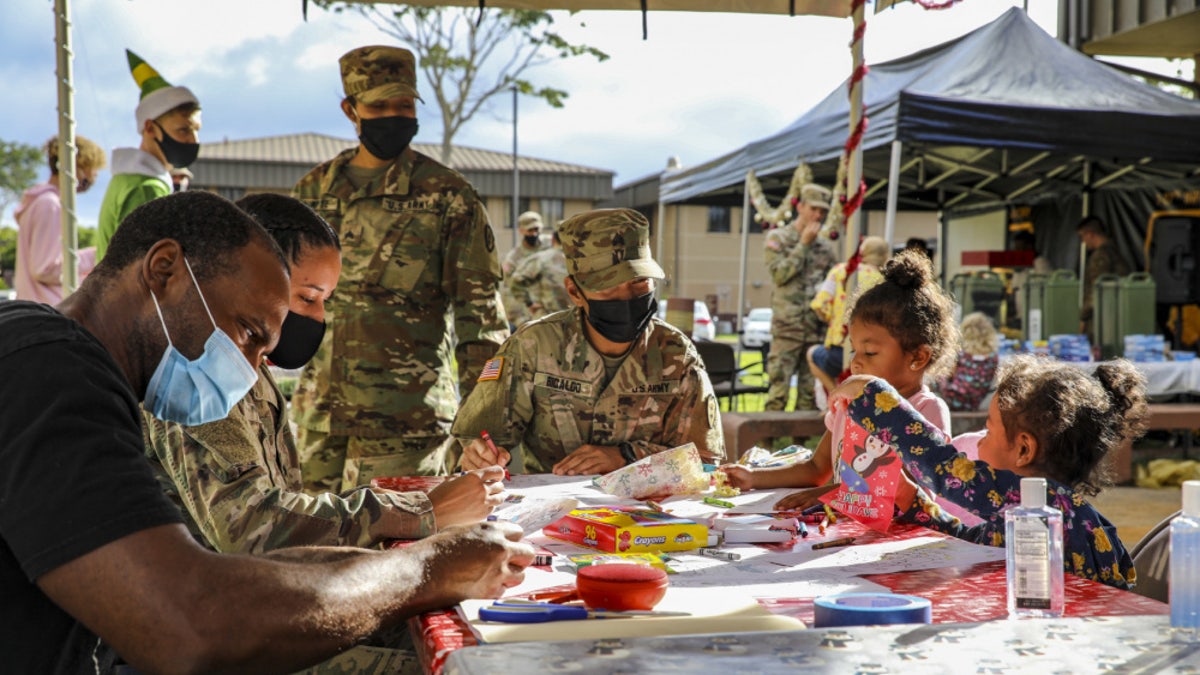 Soldiers and Families with 1st Battalion, 27th Infantry Regiment "Wolfhounds", 2nd Infantry Brigade Combat Team, 25th Infantry Division, create gifts and ornaments to send to the Holy Family Home orphanage on December 4, 2020 at Schofield Barracks, Hawaii. 1-27 IN and the Holy Family Home orphanage in Osaka, Japan, have an enduring relationship dating back to just after World War II, when Soldiers took up a collection for the orphanage during the holiday season in 1949.