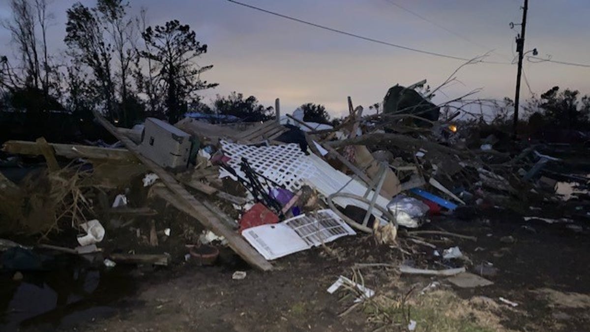 The smith family's mobile home is now a pile of debris on the side of the road following the category 4 storm.