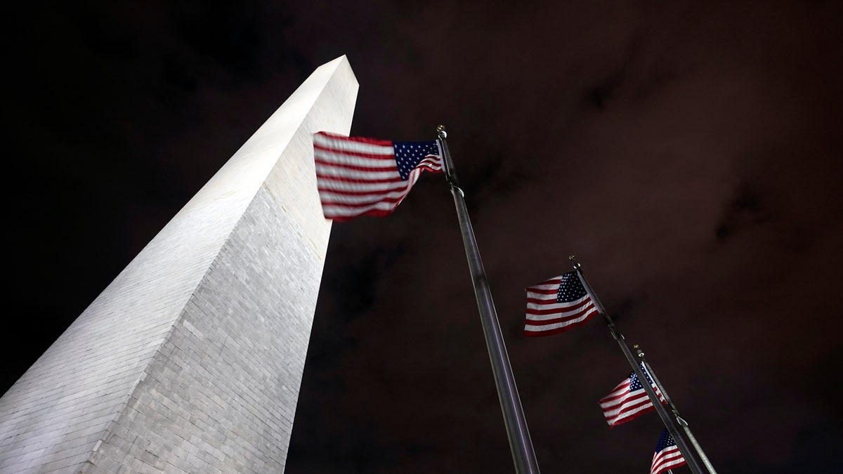 American flags fly around the Washington Monument Friday, Dec. 18, 2020, in Washington. The Trump administration has closed the Washington Monument because of a recent visit by Interior Secretary David Bernhardt, who tested positive this week for the coronavirus. Interior spokesman Nicholas Goodwin says a couple monument workers were quarantining as a result of Bernhardt's visit, forcing a staffing shortage and the monument's closure. (AP Photo/Manuel Balce Ceneta)