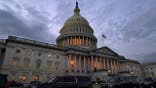 Dusk falls over the Capitol, Monday, Dec. 21, 2020, in Washington. Congressional leaders have hashed out a massive, year-end catchall bill that combines $900 billion in COVID-19 aid with a $1.4 trillion spending bill and reams of other unfinished legislation on taxes, energy, education and health care. (AP Photo/Jacquelyn Martin)