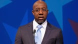 Democratic challenger for U.S. Senate Raphael Warnock speaks during a debate with Republican U.S. Sen. Kelly Loeffler, Sunday, Dec. 6, 2020, in Atlanta. (AP Photo/Ben Gray, Pool)