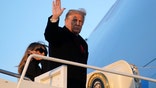 President Donald Trump waves as he boards Air Force One at Andrews Air Force Base, Md., Wednesday, Dec. 23, 2020. Trump is traveling to his Mar-a-Lago resort in Palm Beach, Fla. (AP Photo/Patrick Semansky)