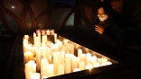 SEOUL, SOUTH KOREA - DECEMBER 31: A woman prays at the Chogey temple during the New Year Eve on December 31, 2020 in Seoul, South Korea. Seoul's city government has cancelled its annual New Year's Eve bell-ringing ceremony in the Jongno neighborhood for the first time since 1953. Normally an estimated 100,000 people would attend the ceremony, in which citizens ring a large bell in a traditional pavilion when the clock strikes midnight. Eeastern coastal areas have closed beaches and other spots where people typically gather on New Year's Day to watch the sunrise. (Photo by Chung Sung-Jun/Getty Images)