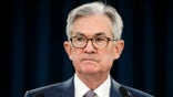 FILE - In this March 3, 2020 file photo, Federal Reserve Chair Jerome Powell pauses during a news conference in Washington.  The Federal Reserve says it will buy short-term loans from banks and companies to support the flow of credit as the economy grinds to a halt amid the viral outbreak. The Fed is reviving a program that it first used during the 2008 financial crisis to unclog a short-term lending market for what is known as “commercial paper.”   (AP Photo/Jacquelyn Martin, File)
