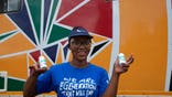 Khanyiswa Kwatsha, who runs a mobile clinic for the Reproductive Health and HIV Institute (RHI) background, shows containers of PrEP medication used in the prevention of HIV infectionin in the Soshanguve Township, north of Pretoria, South Africa, Thursday, Nov. 26 2020. The successful trials of a new injectable drug that needs to be taken every eight weeks to prevent HIV infection is being lauded on World AIDS Day as a turning point for the fight against a global health threat that's been eclipsed by the coronavirus pandemic. (AP Photo/Denis Farrell)