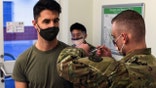 U.S. Army Capt. Skyler Brown, family medicine physician assigned to 1st Squadron, 91st Calvary Regiment (Airborne), 173rd Airborne Brigade Combat Team, is first in all U.S. Army Europe and Africa to receive the coronavirus vaccine. (U.S. European Command Public Affairs)