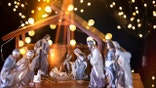 Christmas Manger scene with figurines including Jesus, Mary, Joseph, sheep and wise men. Focus on Mary!