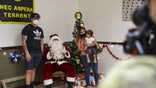 Soldiers and Families with 1st Battalion, 27th Infantry Regiment "Wolfhounds", 2nd Infantry Brigade Combat Team, 25th Infantry Division, hold a holiday party to wrap gifts to donate to the Holy Family Home orphanage on December 4, 2020 at Schofield Barracks, Hawaii. 1-27 IN and the Holy Family Home orphanage in Osaka, Japan, have an enduring relationship dating back to just after World War II, when Soldiers took up a collection for the orphanage during the holiday season in 1949. (U.S. Army photo by Staff Sgt. Thomas Calvert)