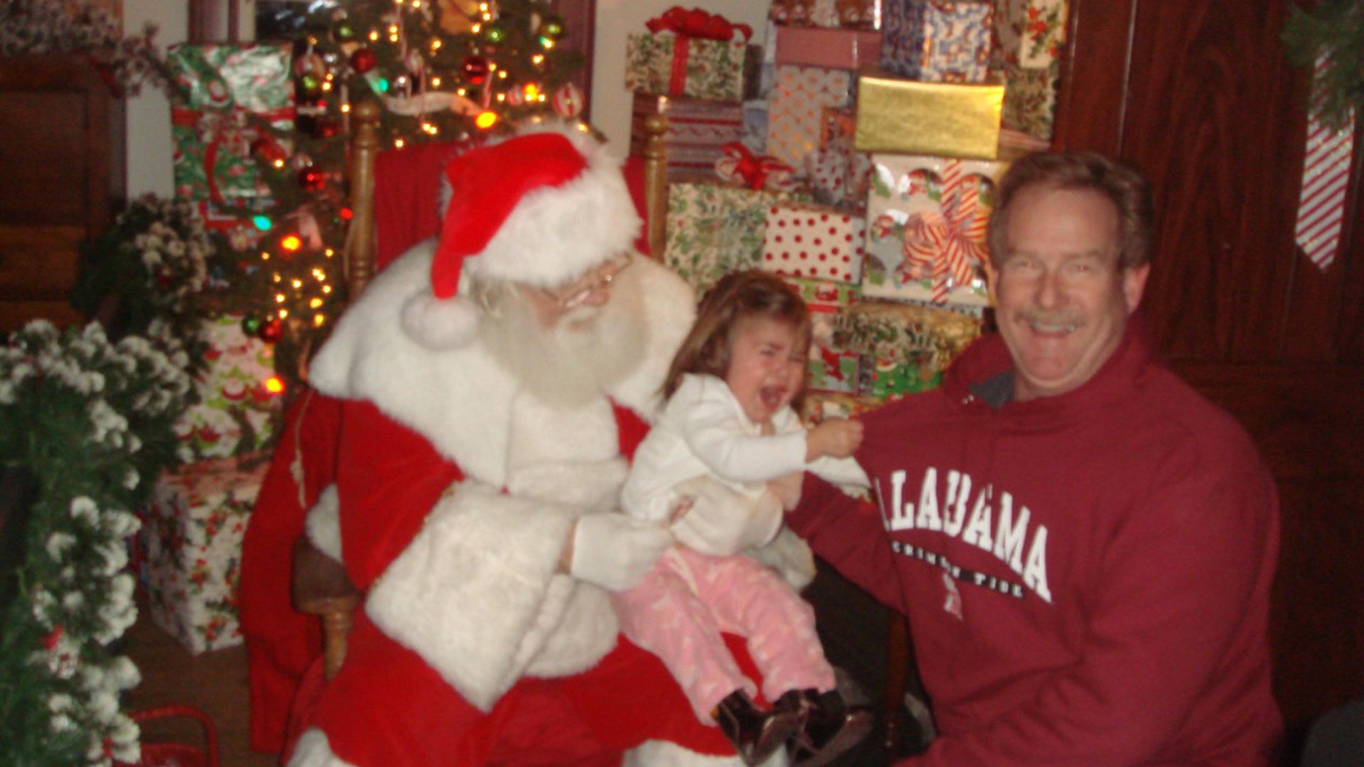 The first year we took our grandchild Anessa to see Santa, we waited in line for a long time at the annual Santa's Village to get that perfect picture. Someone suggested my husband hold her with her back to Santa then walk up and quickly place her down to sit on Santa's lap and run... the perfect Santa picture before she had a chance to cry! Well, obviously... she was quick on the stick because we got the perfect Santa picture, but a lot different than we thought! Her death grip on my husband was tight and she was not letting go! She is almost 12 now and we still bring out this picture to remind her of her first visit with Santa! So adorable. Hope you enjoy and get a big smile remembering some of your own experiences! I took the picture. Barbara Glenn