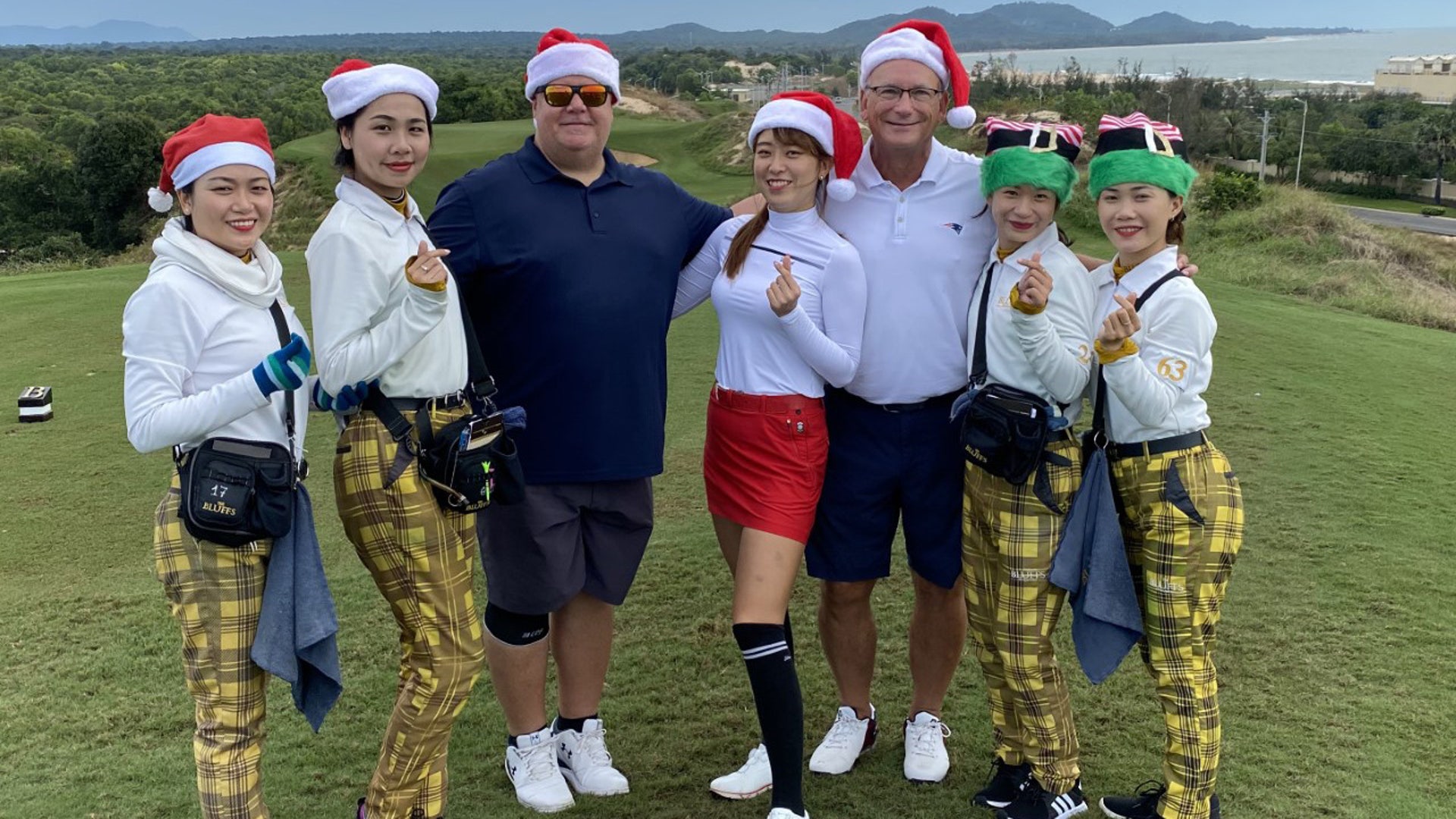Two US Expats living in Vietnam and playing golf on Christmas morning at The Bluffs in Ho Tram Vietnam. Everyone including the caddies got into the Christmas spirit. Merry Christmas and happy new year
