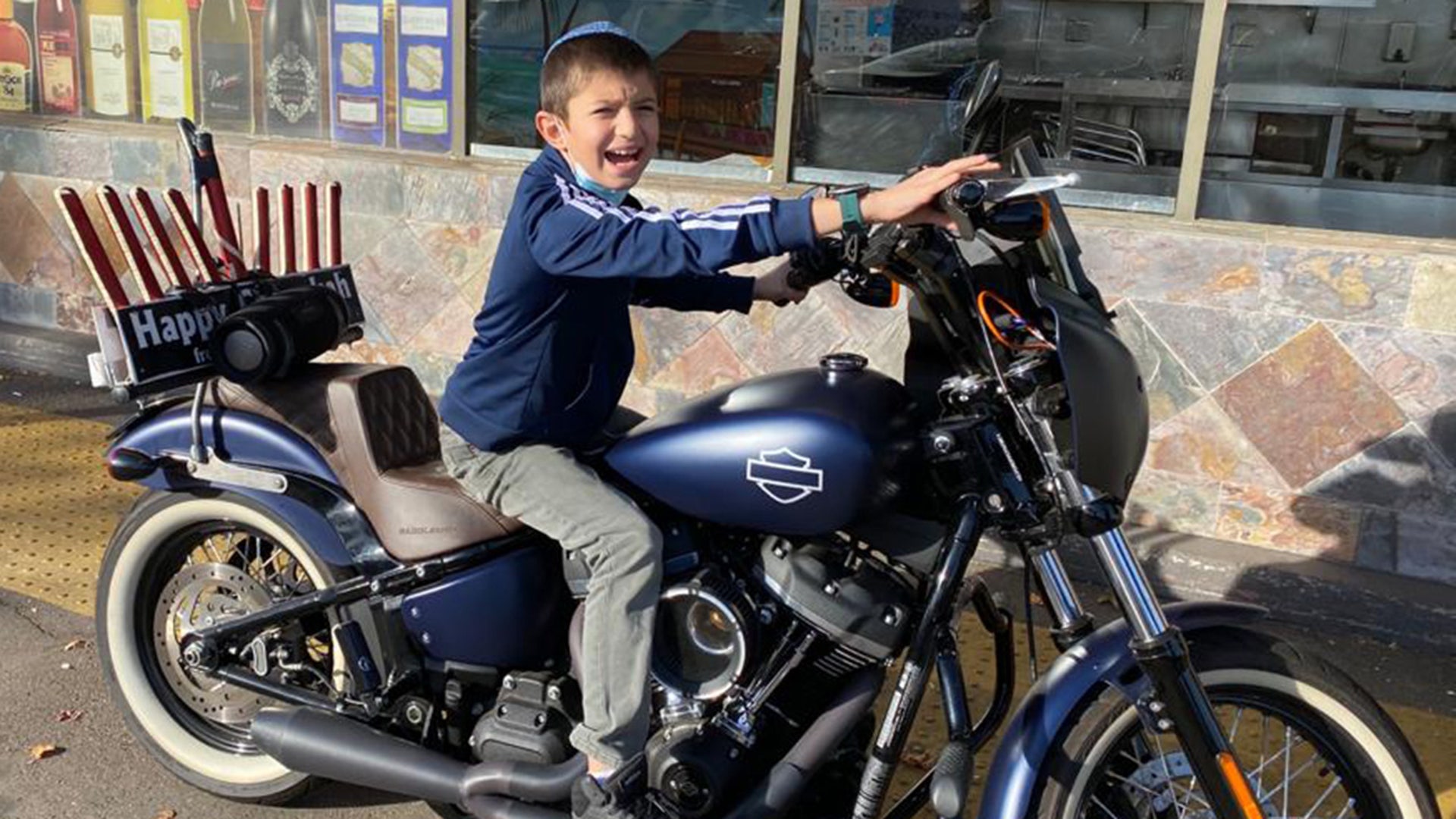 Boy singing hanukkah tunes oblivious to the word around him!!