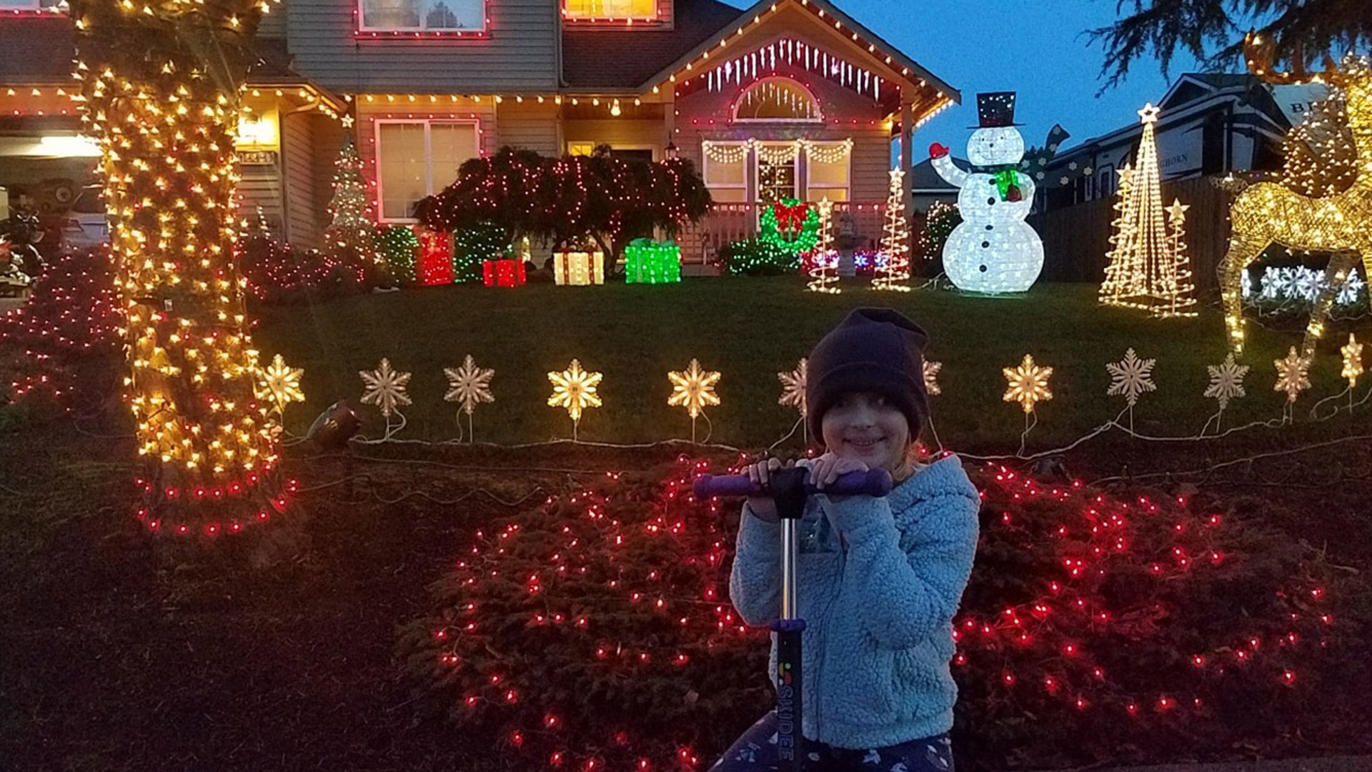 Hanging out with granddaughter Hanah in front of our home in Burlington, WA. Ken Lee