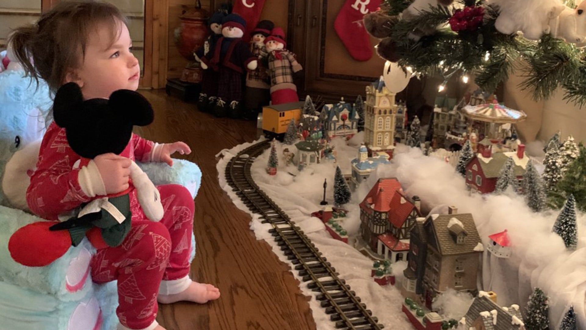 My grand daughter was born overseas in 2018 while her dad was stationed in Europe with the US Army. He is now a first responder in the US. This is my grand daughter's first Christmas in the US and I wanted it to be extra special. All the hours of decorating the tree, arranging each of the village pieces, and laying extra track for the train was worth every minute when I saw the look on her face. Through all the difficulties of this year, the Magic of Christmas can still be seen in the eyes of a child. Nancie Nesbitt Alabama