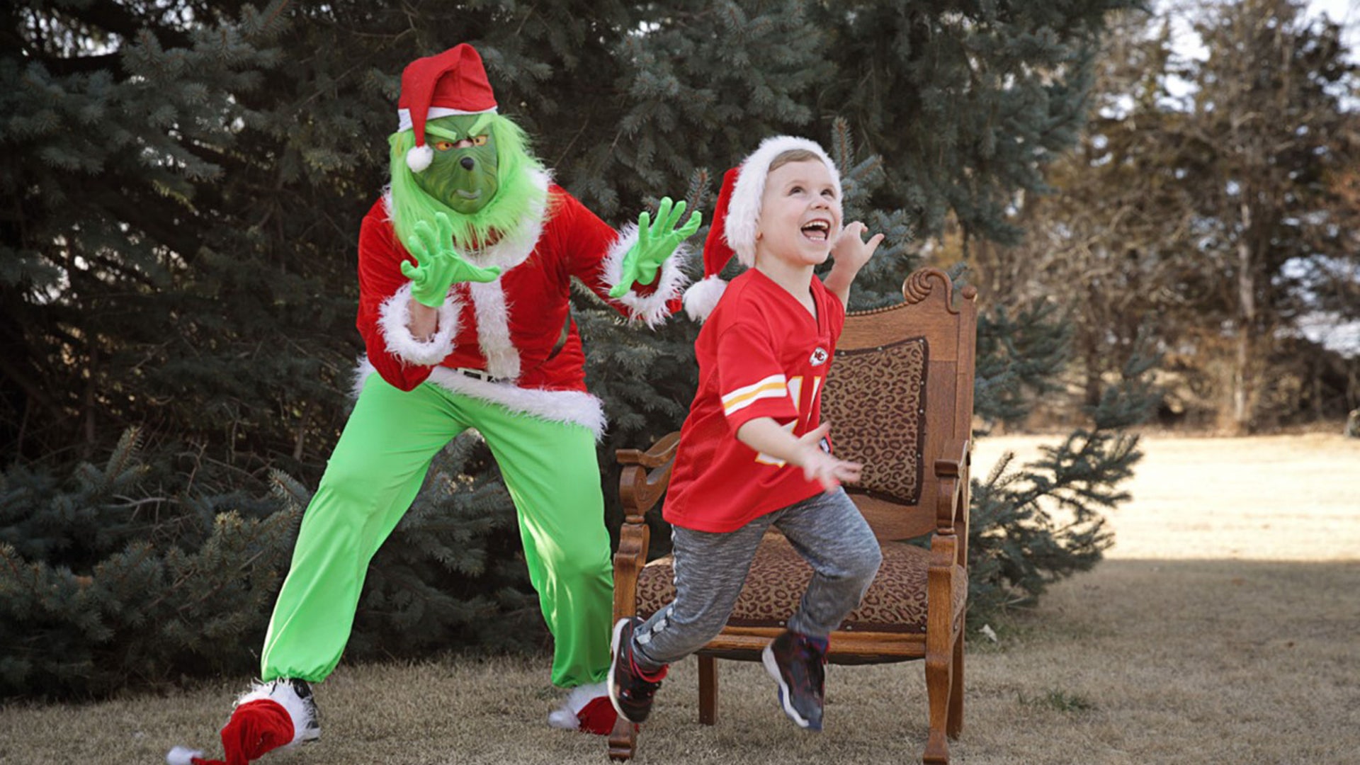 The Grinch vs. a KC Chiefs fan. A surprise visit brought our great grandson off his chair! Merry Christmas to all and to all a goodnight!