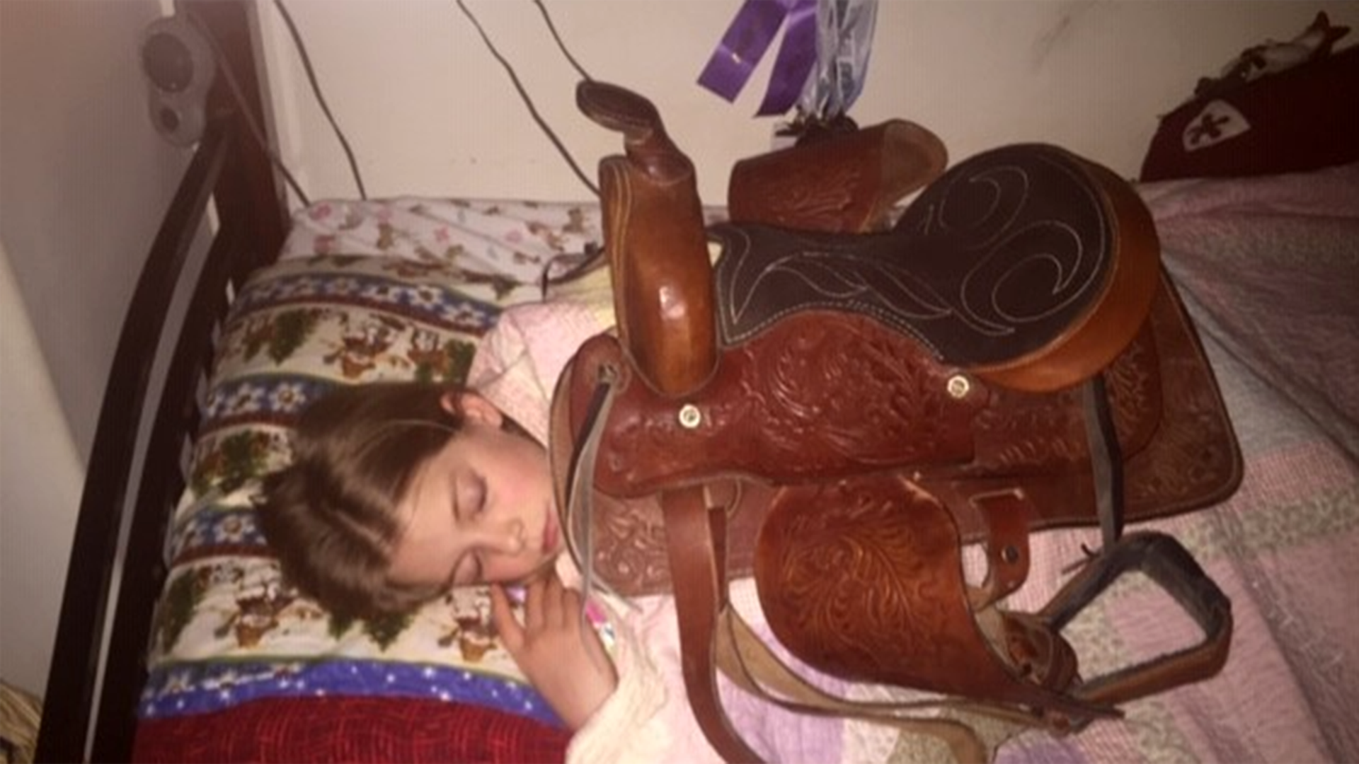 Here is our 9 year old little girl at 1am in the morning with her Christmas Saddle. She had been dreaming and asking for it for over 2 years. She hopes to become a barrel racer and has slept with it every night since Christmas Day. Dad