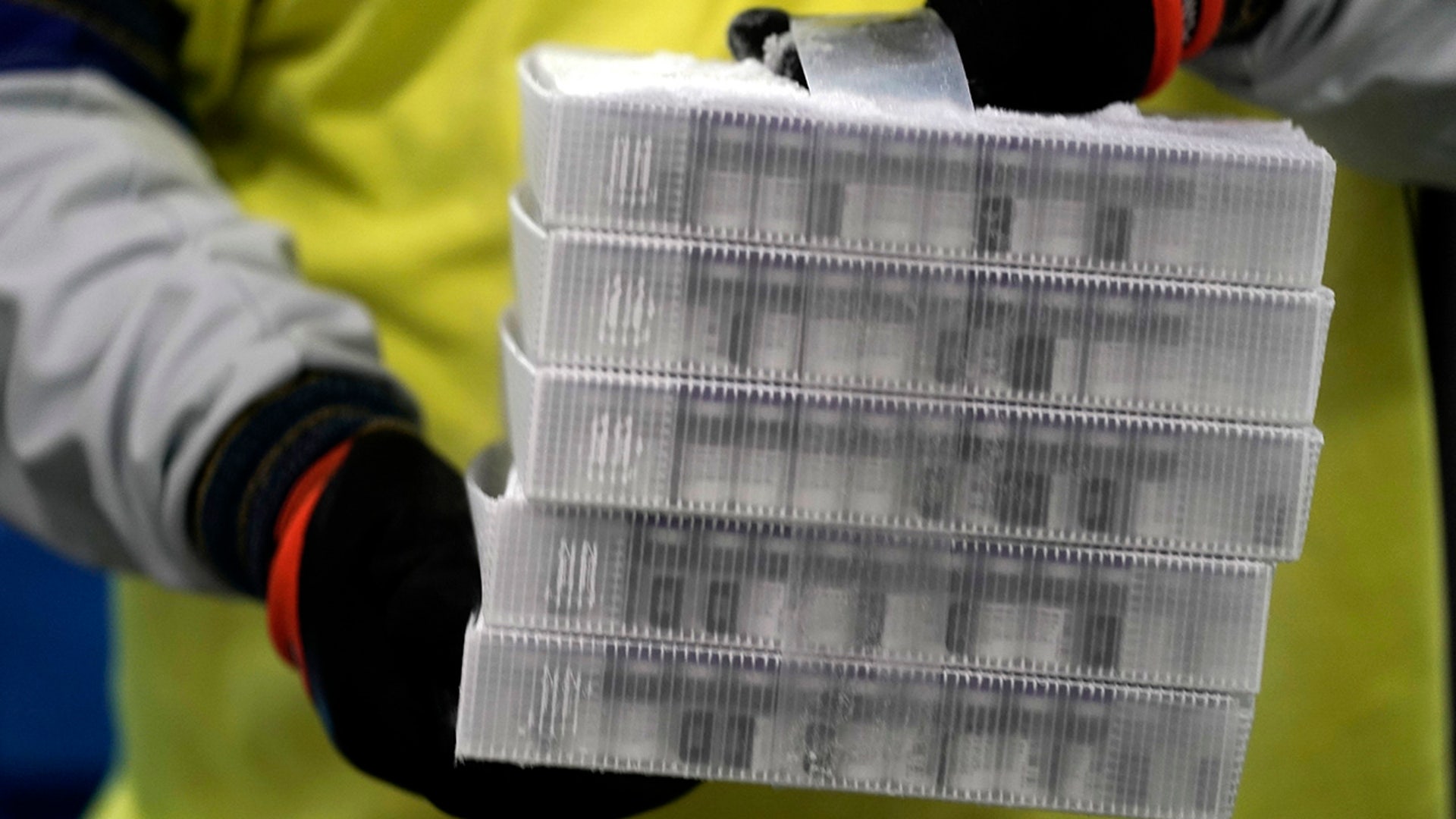 Boxes containing the Pfizer-BioNTech COVID-19 vaccine are prepared to be shipped at the Pfizer Global Supply Kalamazoo manufacturing plant in Portage, Mich., Sunday, Dec. 13, 2020.