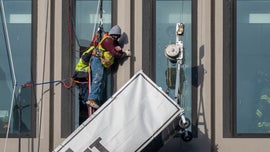 Baltimore building explosion injures 23, traps workers