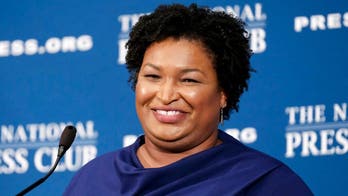 College football coach's firing over Stacey Abrams tweet violated his First Amendment rights, lawsuit says