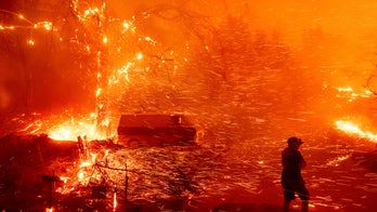 Southern California fires force evacuations, leave 2 firefighters injured; power companies cut electricity