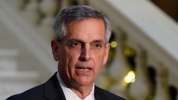 What's in the Georgia law? Voters can cast mail ballots without photo ID, in-person requirements not changed