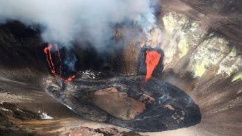Hawaii volcano eruption forms lava lake, can be seen from space