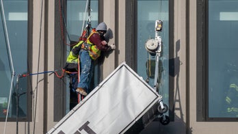 Baltimore building explosion injures 23, traps workers