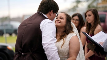 Hurricanes, virus can't stop Louisiana couple's wedding