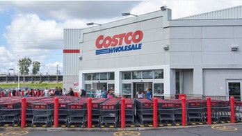 Anti-masker stands on Costco clothing display, makes false claims during megaphone rant, video shows