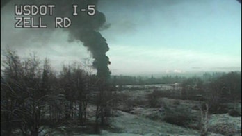 Train carrying crude oil derails, burns north of Seattle