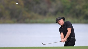 Greg Norman in hospital with virus after father-son tourney