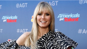 Heidi Klum sunbathes nude in her backyard during 'hot' summer day