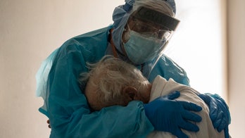 ICU doctor embraces coronavirus patient in viral photo