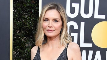Michelle Pfeiffer shows off fiery red hairstyle for movie role