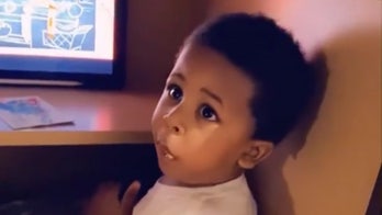 Toddler busted after creating secret hiding space in cabinet to watch cartoons, eat crackers
