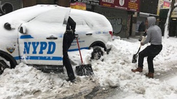 America Together: Good Samaritan helps NYPD officer shovel police cruiser out of snow pile up