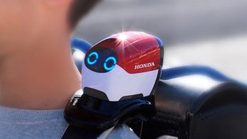 Honda's clever Ropot helps kids cross the street
