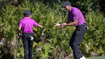 Tiger's son makes TV debut and looks just like he's at home