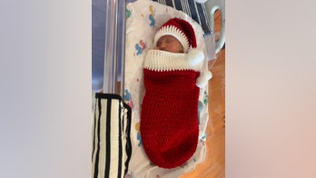 Nurses make Christmas 'onesies' for newborns to cheer up moms