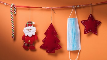 Healthcare workers decorate with PPE for the holidays this year