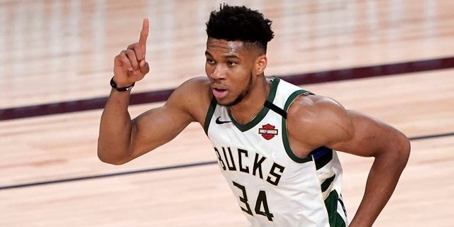 In this Saturday, Aug. 29, 2020, file photo, the Milwaukee Bucks' Giannis Antetokounmpo celebrates after a dunk against Orlando during the first half of an NBA basketball first-round playoff game in Lake Buena Vista, Fla. (AP Photo/Ashley Landis, File)