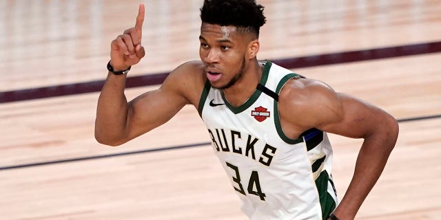 In this Saturday, Aug. 29, 2020, file photo, the Milwaukee Bucks' Giannis Antetokounmpo celebrates after a dunk against Orlando during the first half of an NBA basketball first-round playoff game in Lake Buena Vista, Fla. (AP Photo/Ashley Landis, File)