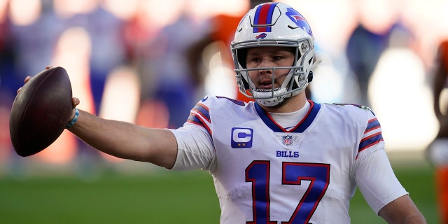 Buffalo Bills quarterback Josh Allen celebrates after scoring a touchdown during the first half of an NFL football game against the Denver Broncos, Saturday, Dec. 19, 2020, in Denver. (AP Photo/Jack Dempsey)