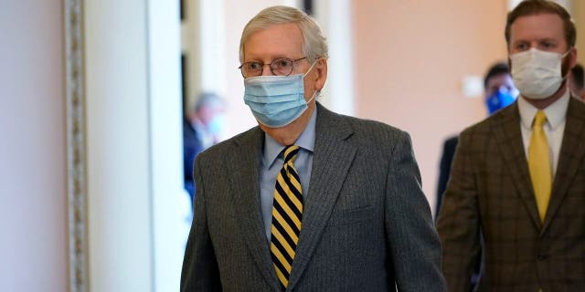 Senate Majority Leader Mitch McConnell of Ky., walks to the Senate floor on Capitol Hill in Washington, Wednesday, Dec. 30, 2020. (AP Photo/Susan Walsh)